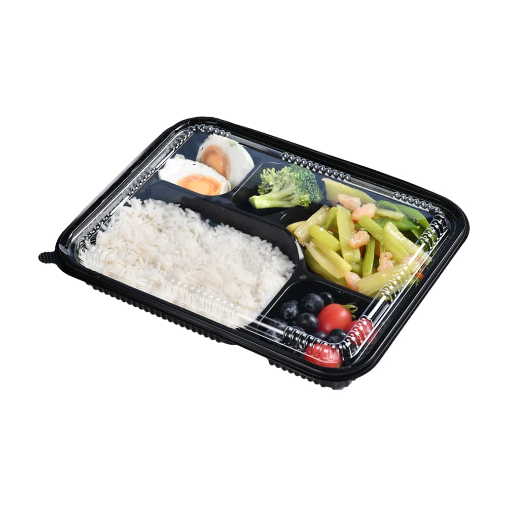 A black 5-compartment lunch box filled with rice, eggs, vegetables and fruits