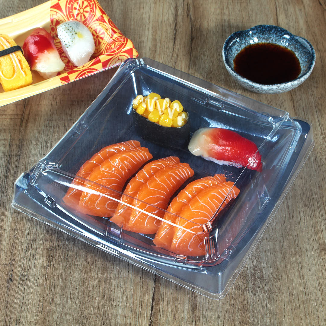 WL-B40 clear blue sushi tray with sushis and salmon in it