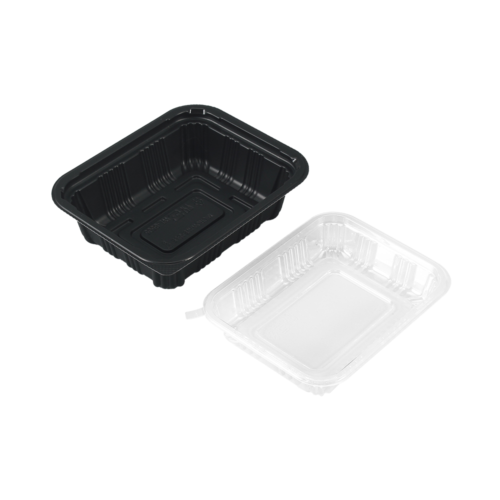 The bottom of a black bento box and a transparent lid at 45 degrees