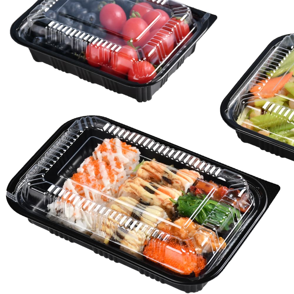 One bento box with sushi and two small bento boxes each with fruit food