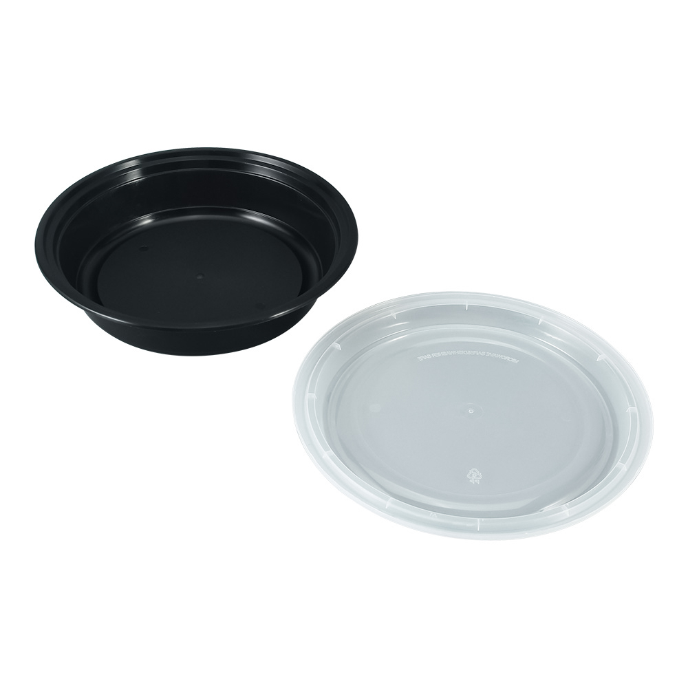 A black round plastic bento box with a transparent lid on a white background