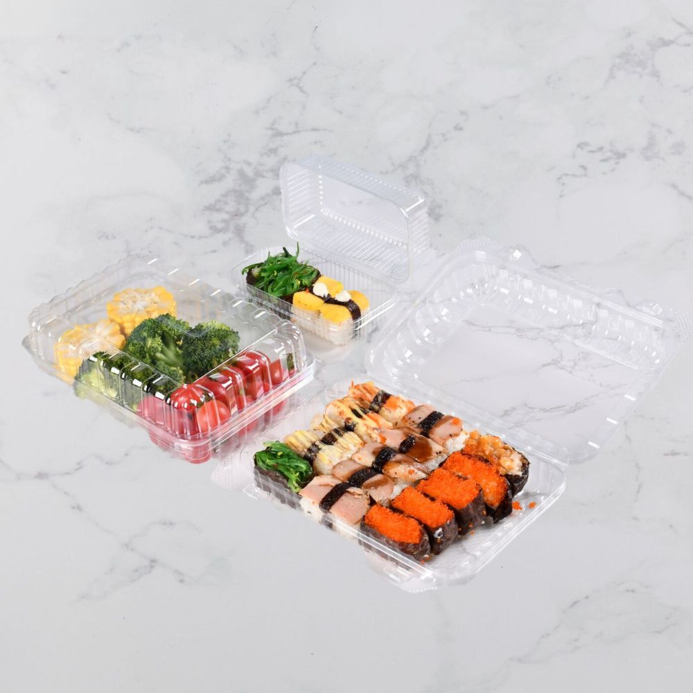 three clamshell containers of different sizes are packed with sushi
