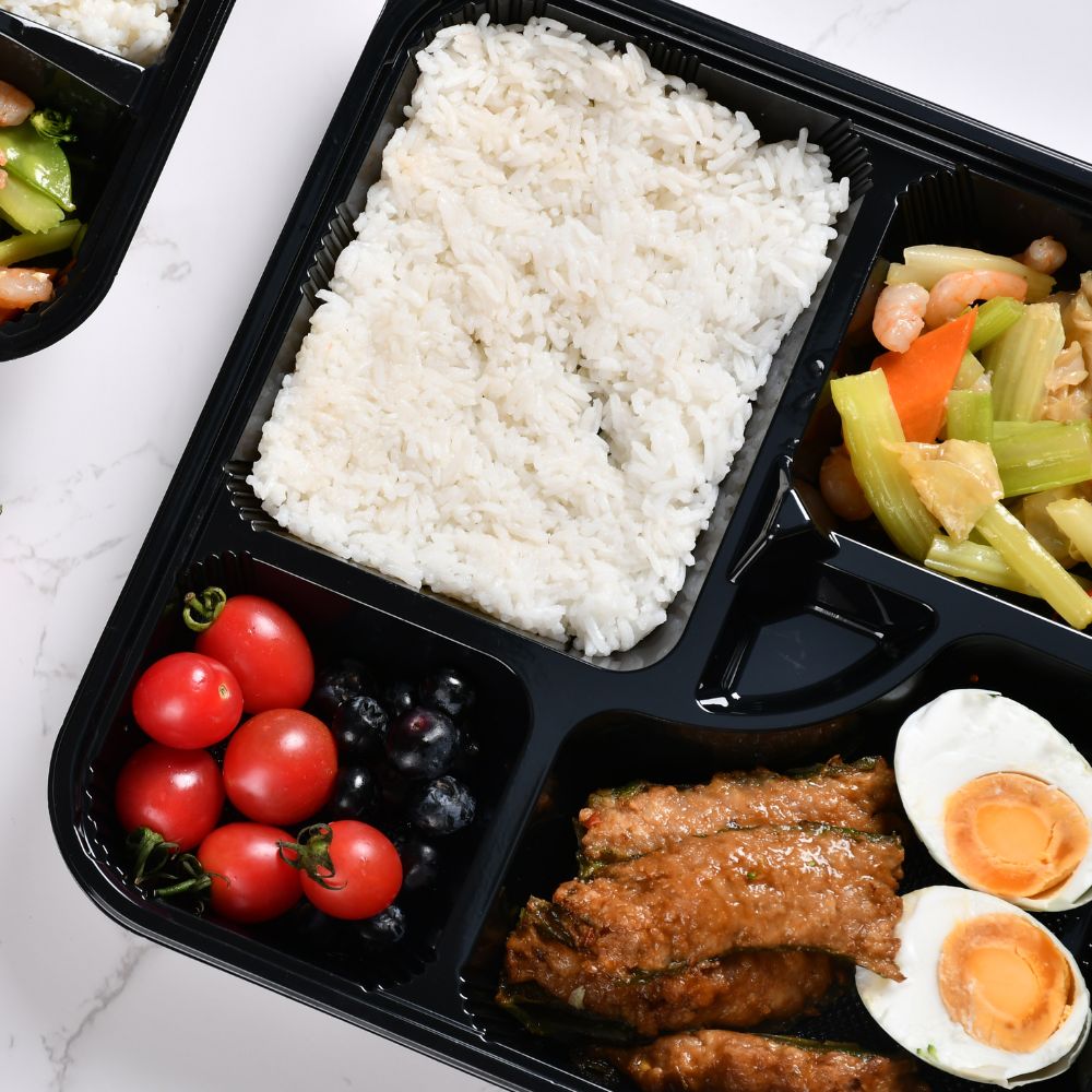 Each section of the 5-compartment bento box contains a different food item