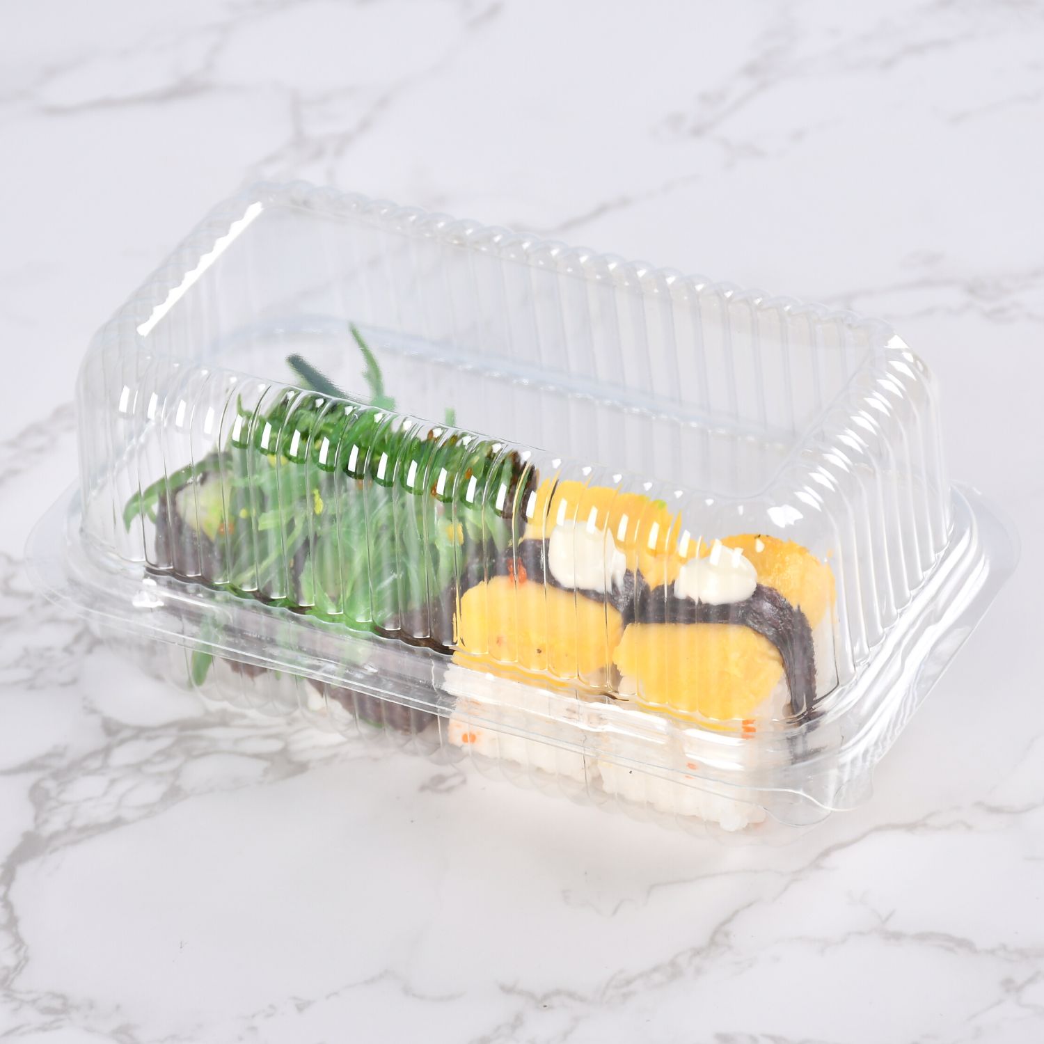 Transparent clamshell container with 4 pieces of sushi